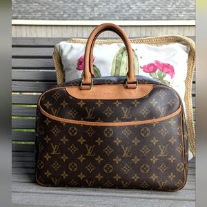 Louis Vuitton Brown Monogram Travel Bag. Not used by me. Excellent condition.